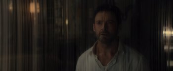 Movie still from “Reminiscence” (2021), directed by Lisa Joy – A person wearing a white shirt; Close Up shot, Low angle