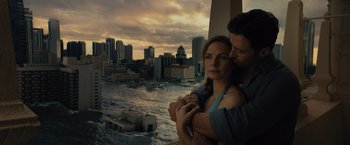 Movie still from “Reminiscence” (2021), directed by Lisa Joy – A man and a woman standing next to each other in front of a body of water; Medium shot, High angle