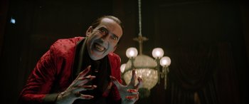 Movie still from “Renfield” (2023), directed by Chris McKay – A man with blood on his face and hands; Close Up shot, Low angle