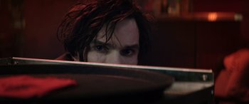 Movie still from “Renfield” (2023), directed by Chris McKay – A person looking at the camera; Close Up shot, High angle