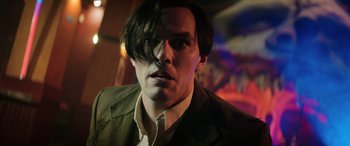 Movie still from “Renfield” (2023), directed by Chris McKay – A person wearing a jacket; Close Up shot, Low angle