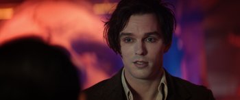 Movie still from “Renfield” (2023), directed by Chris McKay – A person with long hair; Close Up shot, Over the shoulder angle