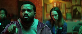 Movie still from “Renfield” (2023), directed by Chris McKay – A man and a woman are standing next to each other; Medium shot, Low angle