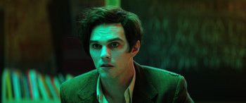 Movie still from “Renfield” (2023), directed by Chris McKay – A person wearing a suit; Close Up shot, Over the shoulder angle