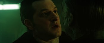 Movie still from “Renfield” (2023), directed by Chris McKay – A person looking at the camera; Close Up shot, Over the shoulder angle