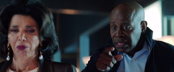 Movie still from “Renfield” (2023), directed by Chris McKay – A man and a woman talking to each other; Close Up shot, Over the shoulder angle