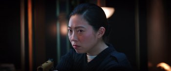 Movie still from “Renfield” (2023), directed by Chris McKay – A person sitting in front of a window; Close Up shot, Low angle