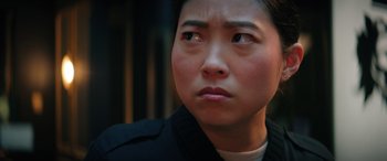 Movie still from “Renfield” (2023), directed by Chris McKay – A person looking at the camera; Close Up shot, Over the shoulder angle