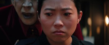 Movie still from “Renfield” (2023), directed by Chris McKay – A person's face looking at the camera; Extreme Close Up shot, High angle