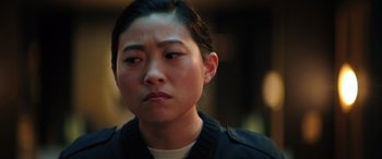 Movie still from “Renfield” (2023), directed by Chris McKay – A person wearing a jacket; Close Up shot, Over the shoulder angle