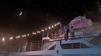 Movie still from “Reno 911!: The Hunt for QAnon” (2021), directed by Robert Ben Garant – Two people are standing on a deck at night; Extreme Wide shot, Low angle