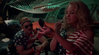 Movie still from “Reno 911!: The Hunt for QAnon” (2021), directed by Robert Ben Garant – A man and a woman are sitting in front of a mirror; Medium shot, Over the shoulder angle