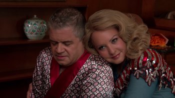 Movie still from “Reno 911!: The Hunt for QAnon” (2021), directed by Robert Ben Garant – A man and a woman sitting next to each other; Close Up shot, Over the shoulder angle