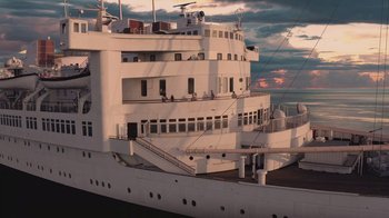 Movie still from “Reno 911!: The Hunt for QAnon” (2021), directed by Robert Ben Garant – A large white boat with stairs going down the side of it; Extreme Wide shot, High angle