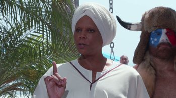 Movie still from “Reno 911!: The Hunt for QAnon” (2021), directed by Robert Ben Garant – An older woman with a turban on her head; Close Up shot, Low angle