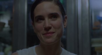 Movie still from “Requiem for a Dream” (2000), directed by Darren Aronofsky – A person smiling for the camera; Close Up shot, Over the shoulder angle