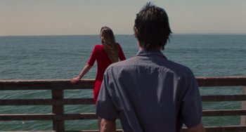 Movie still from “Requiem for a Dream” (2000), directed by Darren Aronofsky – A man and a woman looking out at the ocean; Medium shot, Low angle