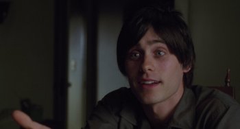 Movie still from “Requiem for a Dream” (2000), directed by Darren Aronofsky – A young man sitting in front of a mirror; Close Up shot, Over the shoulder angle