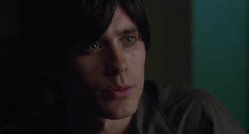 Movie still from “Requiem for a Dream” (2000), directed by Darren Aronofsky – A man's face in the dark; Close Up shot, High angle