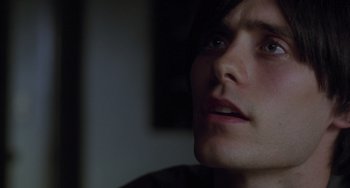 Movie still from “Requiem for a Dream” (2000), directed by Darren Aronofsky – A person looking up at the sky; Close Up shot, High angle