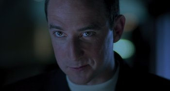 Movie still from “Requiem for a Dream” (2000), directed by Darren Aronofsky – A man's face in the dark; Close Up shot, Low angle