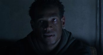 Movie still from “Requiem for a Dream” (2000), directed by Darren Aronofsky – A person wearing a sweater; Close Up shot, Low angle