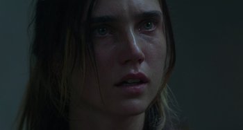 Movie still from “Requiem for a Dream” (2000), directed by Darren Aronofsky – A woman's face with tears in her eyes; Close Up shot, Over the shoulder angle