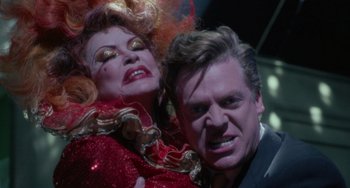 Movie still from “Requiem for a Dream” (2000), directed by Darren Aronofsky – A man and a woman are posing for a picture; Close Up shot, Over the shoulder angle