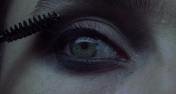 Movie still from “Requiem for a Dream” (2000), directed by Darren Aronofsky – A person's eye with the reflection of a tree in it; Extreme Close Up shot, Overhead angle