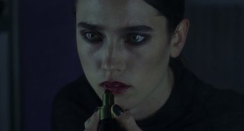 Movie still from “Requiem for a Dream” (2000), directed by Darren Aronofsky – A woman is holding a bottle in her mouth; Extreme Close Up shot, Over the shoulder angle