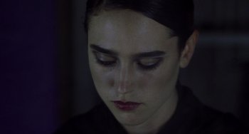 Movie still from “Requiem for a Dream” (2000), directed by Darren Aronofsky – A person with makeup on; Close Up shot, High angle