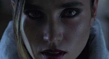 Movie still from “Requiem for a Dream” (2000), directed by Darren Aronofsky – A woman's eyes and lips; Extreme Close Up shot, Overhead angle