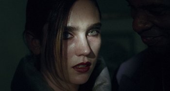 Movie still from “Requiem for a Dream” (2000), directed by Darren Aronofsky – A person with green eyes; Close Up shot, Over the shoulder angle