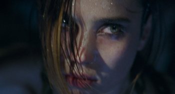 Movie still from “Requiem for a Dream” (2000), directed by Darren Aronofsky – A woman's face with water droplets on it; Extreme Close Up shot, High angle