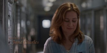 Movie still from “Rescued by Ruby” (2022), directed by Katt Shea – A person looking down at something; Close Up shot, Over the shoulder angle