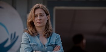 Movie still from “Rescued by Ruby” (2022), directed by Katt Shea – A person with her arms crossed; Close Up shot, Over the shoulder angle