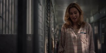 Movie still from “Rescued by Ruby” (2022), directed by Katt Shea – A woman in a pink and white checkered shirt; Close Up shot, Over the shoulder angle