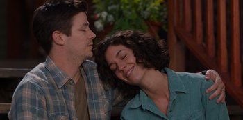 Movie still from “Rescued by Ruby” (2022), directed by Katt Shea – A man and a woman are sitting close to each other; Close Up shot, Over the shoulder angle