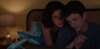 Movie still from “Rescued by Ruby” (2022), directed by Katt Shea – A man and a woman in a bed looking at the camera; Close Up shot, High angle
