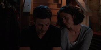 Movie still from “Rescued by Ruby” (2022), directed by Katt Shea – A man and a woman sitting next to each other; Close Up shot, Over the shoulder angle