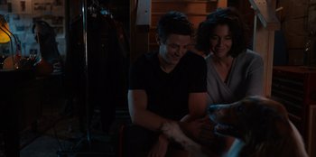 Movie still from “Rescued by Ruby” (2022), directed by Katt Shea – A man and a woman sitting next to each other in a room; Medium shot, Over the shoulder angle