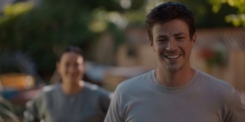 Movie still from “Rescued by Ruby” (2022), directed by Katt Shea – A man and a woman smiling for the camera; Close Up shot, Over the shoulder angle