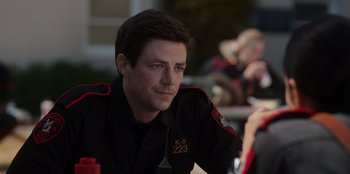 Movie still from “Rescued by Ruby” (2022), directed by Katt Shea – A man in uniform sitting in front of a group of people; Close Up shot, Over the shoulder angle