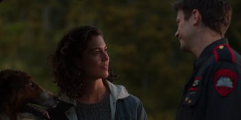 Movie still from “Rescued by Ruby” (2022), directed by Katt Shea – Two people are talking in the dark outside; Close Up shot, Over the shoulder angle