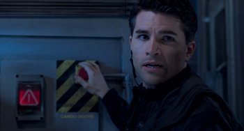 Movie still from “Resident Evil” (2002), directed by Paul W.S. Anderson – A person holding an apple; Close Up shot, Over the shoulder angle