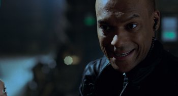 Movie still from “Resident Evil” (2002), directed by Paul W.S. Anderson – A person wearing a black jacket; Close Up shot, Overhead angle