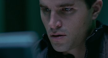 Movie still from “Resident Evil” (2002), directed by Paul W.S. Anderson – A man's face in a dark room; Close Up shot, Low angle