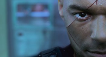 Movie still from “Resident Evil” (2002), directed by Paul W.S. Anderson – A man's face with a mask on; Extreme Close Up shot, Low angle