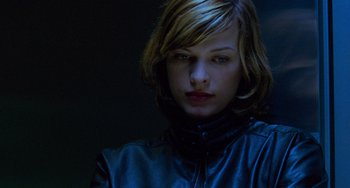 Movie still from “Resident Evil” (2002), directed by Paul W.S. Anderson – A person wearing a leather jacket; Close Up shot, Low angle