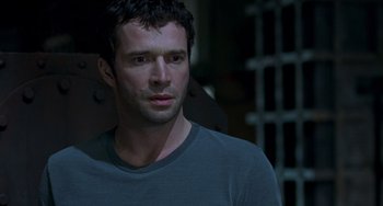 Movie still from “Resident Evil” (2002), directed by Paul W.S. Anderson – A person wearing a t - shirt; Close Up shot, Low angle